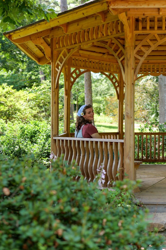 Woman under gazebo in park